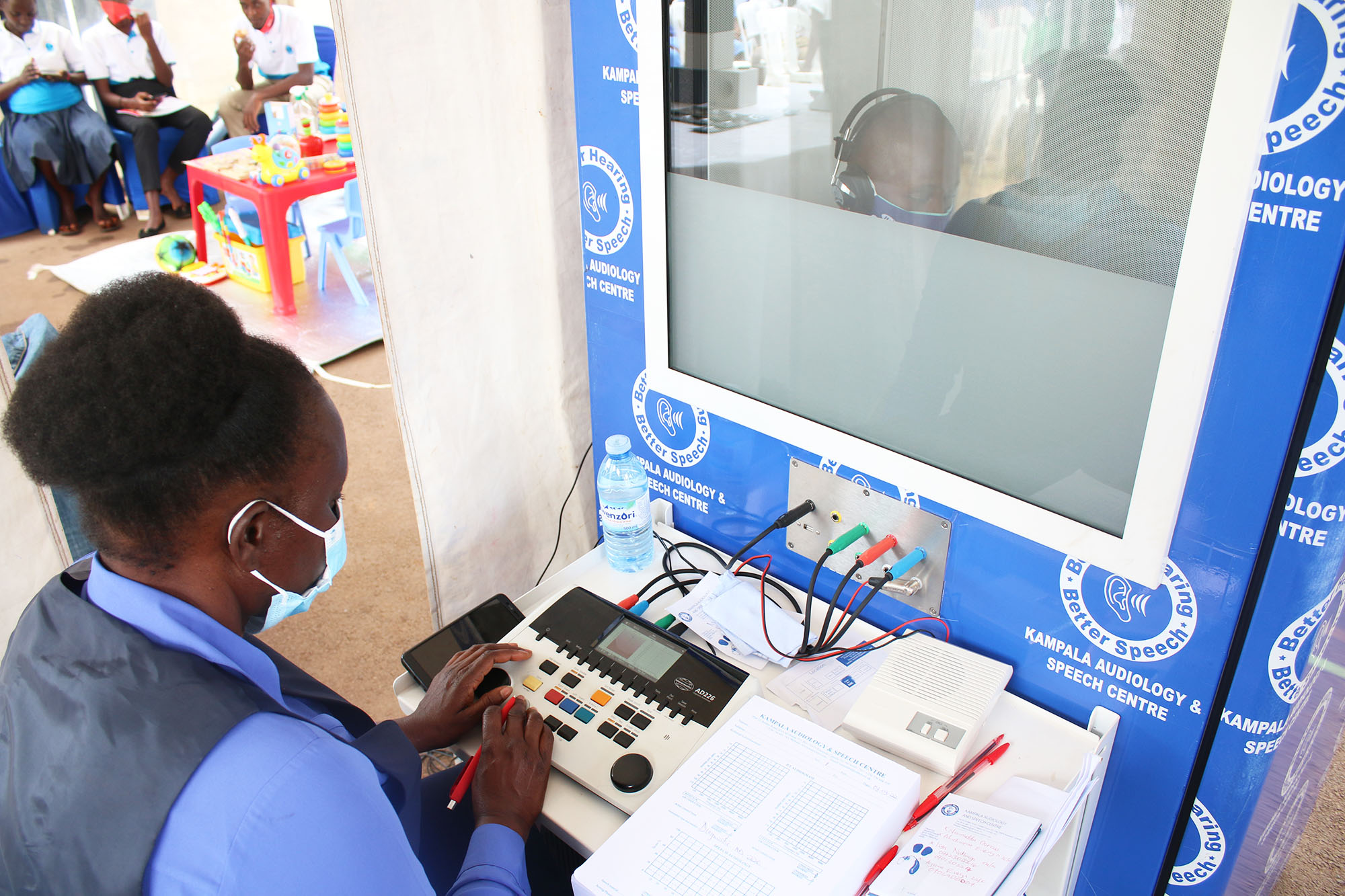 Ms. Josephine Likichoru carries out hearing test using our mobile audiology booth during World Hearing Day 2022